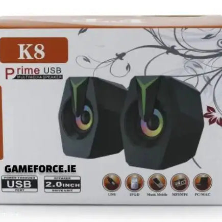 SPEAKER PRIME USB K8 GAMING SPEAKERS showing compact design with RGB lighting on a gaming desktop setup